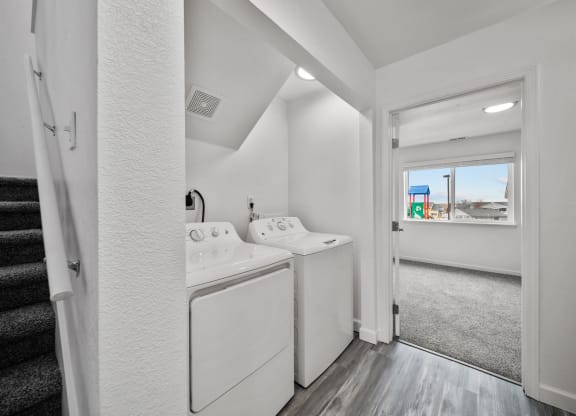 a laundry room with a washer and dryer