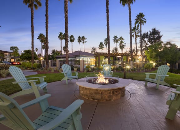 Estancia at Mission Grove Apartments Fire pit at night