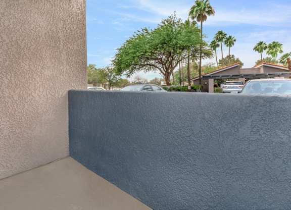 A wall with a blue painted section in the middle.