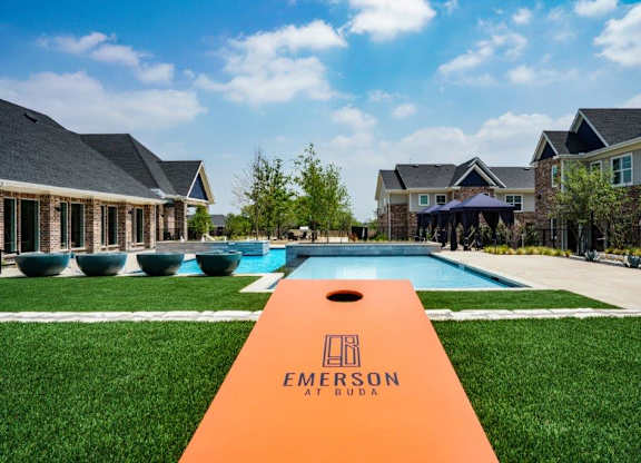 A view of a swimming pool and a sign that says Emerson.