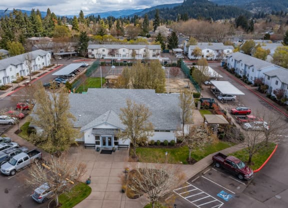 arial view of a neighborhood with houses and cars parked in the parking lot