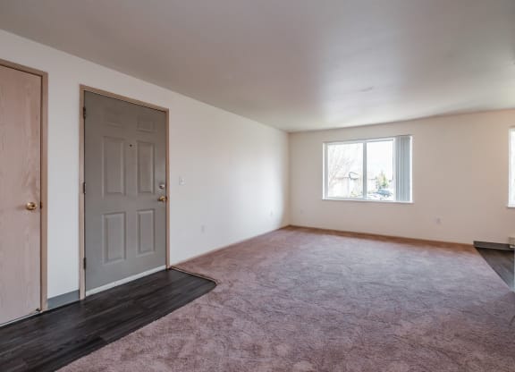 a bedroom with a door and a window