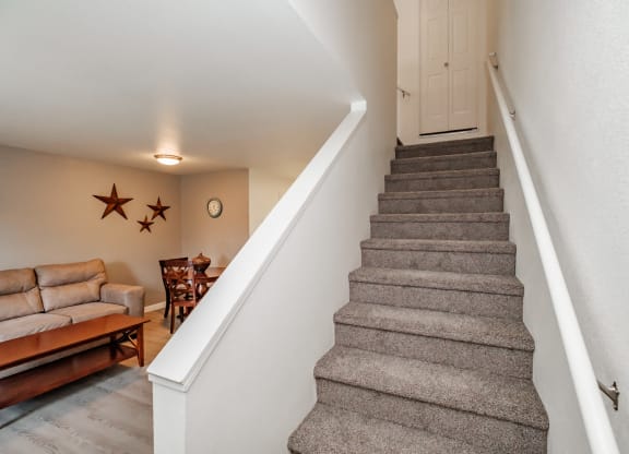 a view of the stairs to the 2nd floor
