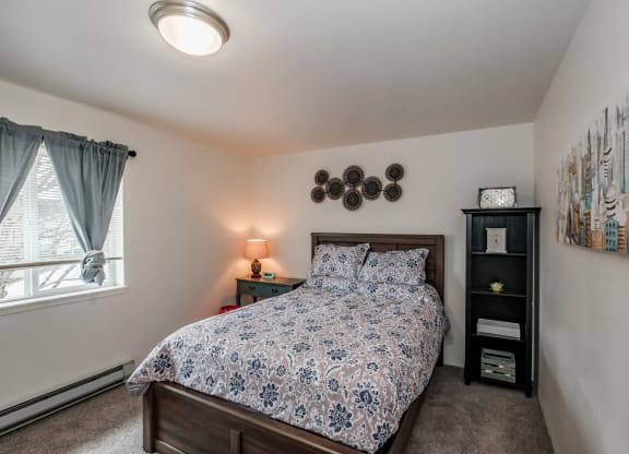 a bedroom with a bed and two night stands