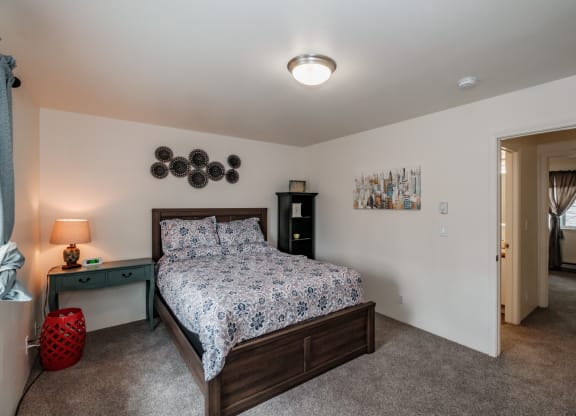 a bedroom with a bed and a nightstand