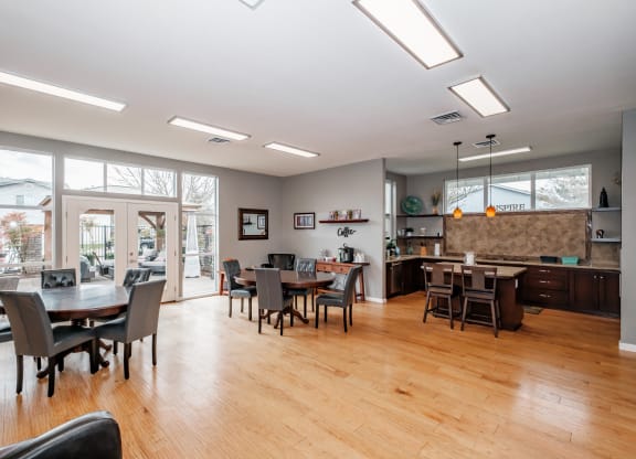 a large living room with a kitchen and dining area
