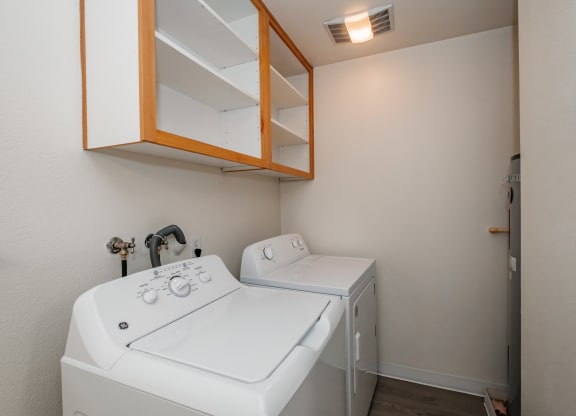 a small laundry room with a washer and dryer