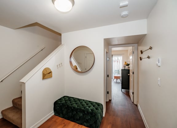 a view of the hallway from the top of the stairs