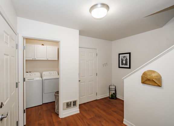 a small laundry room with a washer and dryer