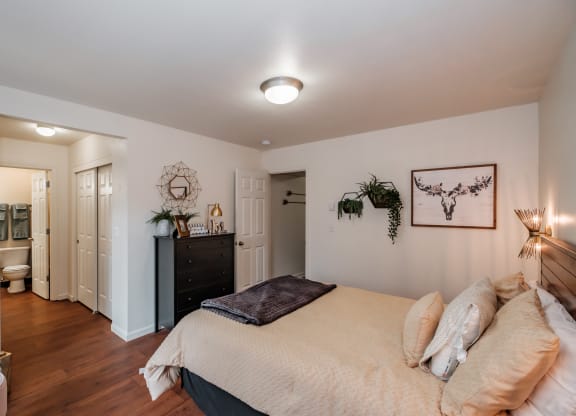 a bedroom with a bed and a dresser