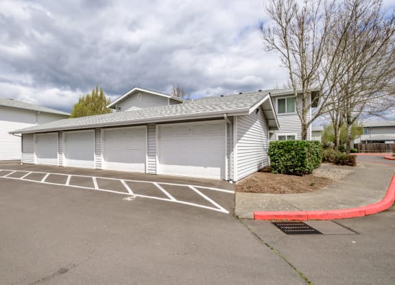 a garage with a carport in front of a house