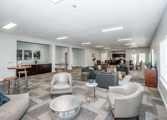 a common area with couches chairs and tables