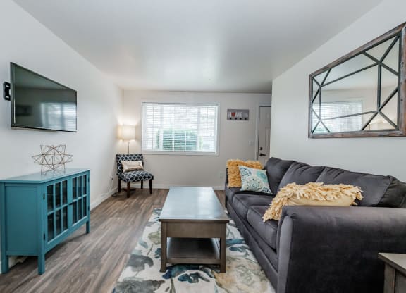 a living room with a couch and a coffee table
