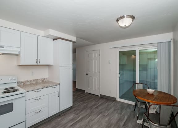 a kitchen and dining area in a 555 waverly unit