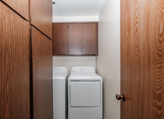 a small laundry room with a washer and dryer