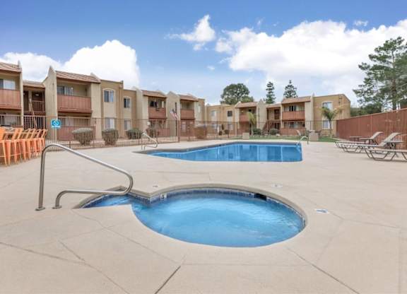 Fox Point Apartments in Tucson, Arizona Pool with Lounge Chairs and Hot Tub