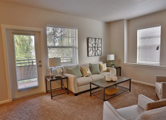 a living room with a couch and a table
