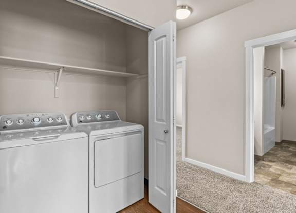 A laundry room with a washer and dryer.
