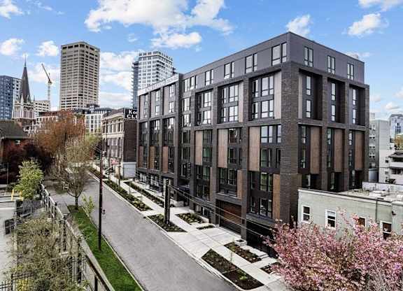 A modern building with a lot of windows is in the foreground.