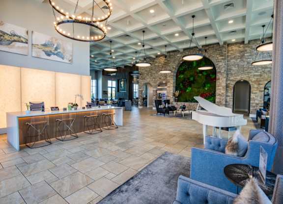 A reception area with a white piano and a reception desk.