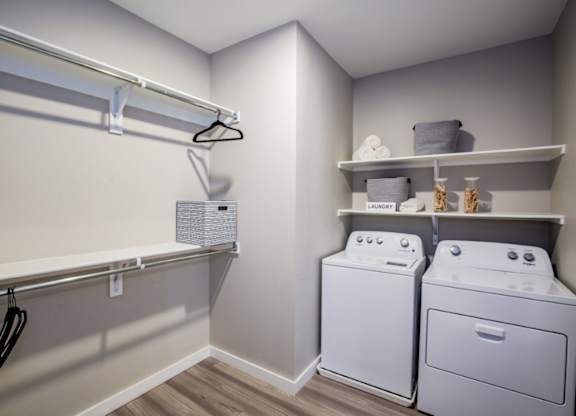 A laundry room with a washer and dryer.