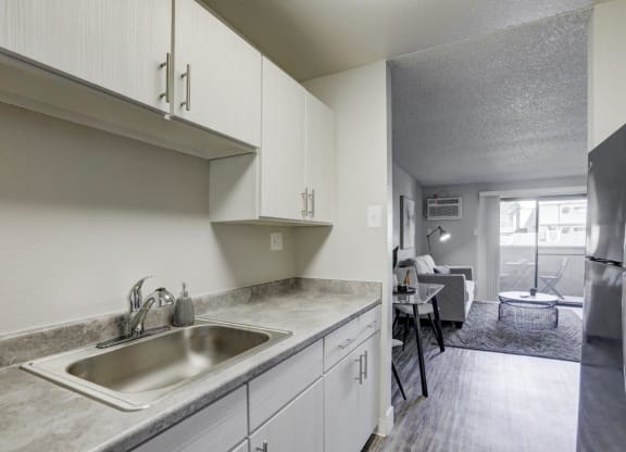 Hudson at Highline Apartments in Denver, Colorado Model Kitchen and View into Living Room