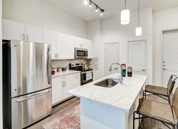 The Dylan kitchen with white cabinetry and stainless steel appliances