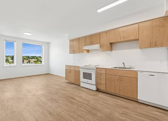 A kitchen with wooden cabinets and white appliances.