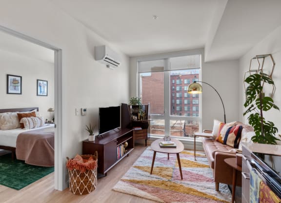 The Warren Model Living Room and View into Bedroom