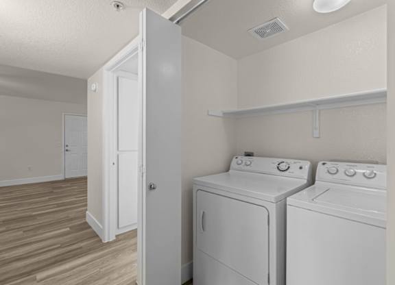 A laundry room with a washer and dryer.