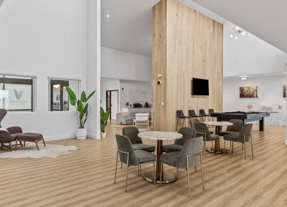 a living room filled with furniture and a flat screen tv