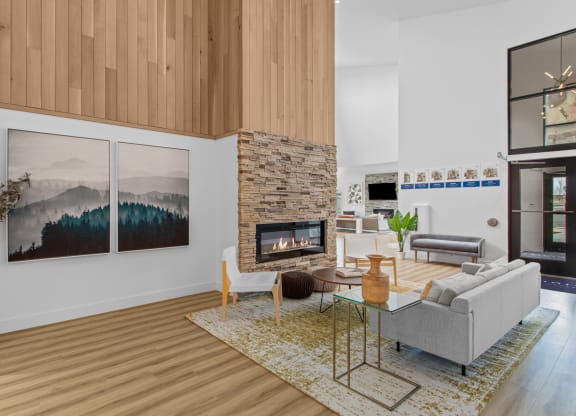 a rendering of a living room with a stone fireplace and wood floors