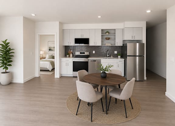 A modern kitchen with a dining table set for four.