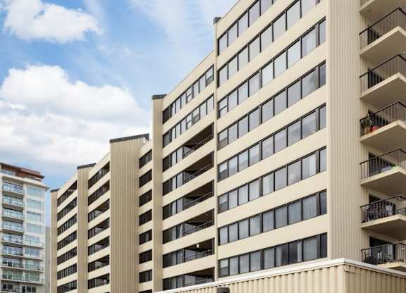 A large beige building with many windows and balconies.at Lake Tower, Coeur d'Alene