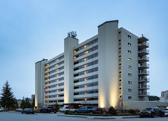 A large, modern building with a parking lot in front of it.at Lake Tower, Coeur d'Alene, 83814