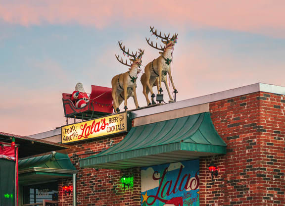 a building with a statue of deer on top of it