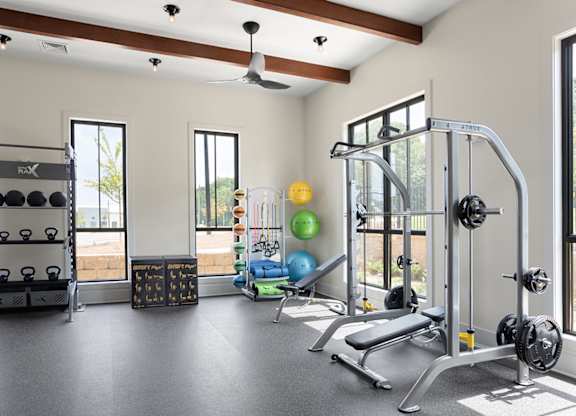 A well-equipped gym with a variety of exercise equipment.