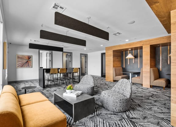 a large living room with a black and white patterned carpet