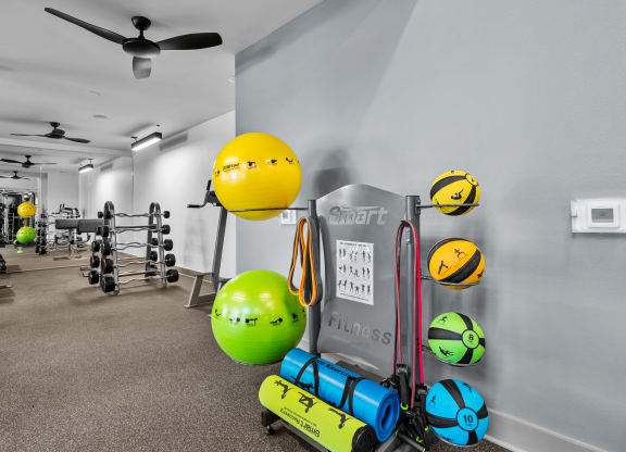 the gym at the enclave at woodbridge apartments in sugar land, tx