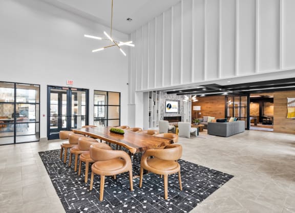 a large conference room with a long wooden table and chairs