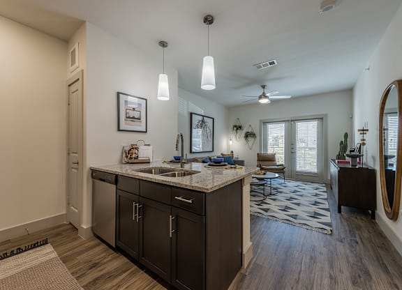 A kitchen with a sink and a counter.