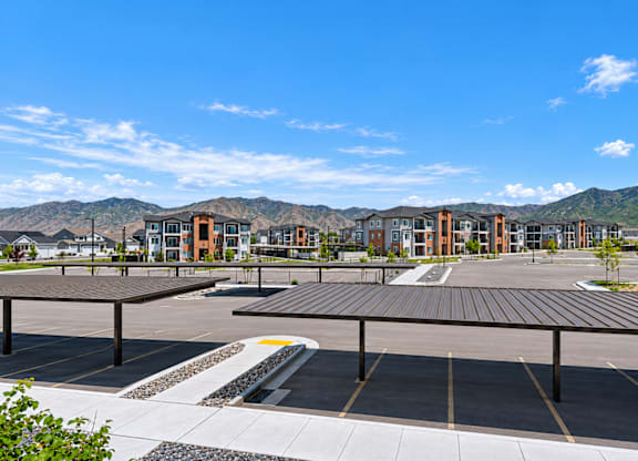 A parking lot with a mountain in the background.