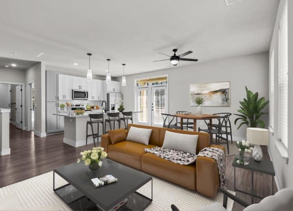 a living room and kitchen with a couch and a table at Lenox Grand, Austin, TX 