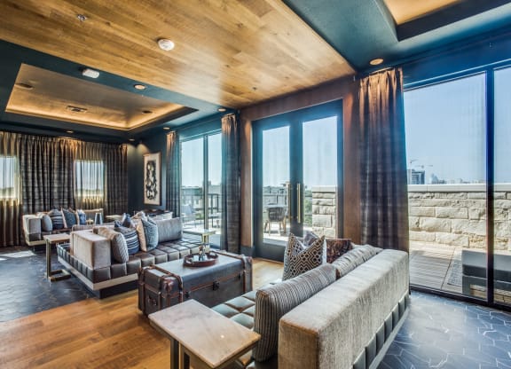 a living room filled with furniture and a large window