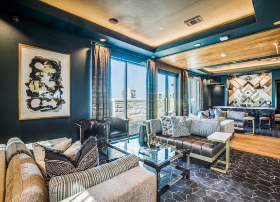 a living room filled with furniture and a large window