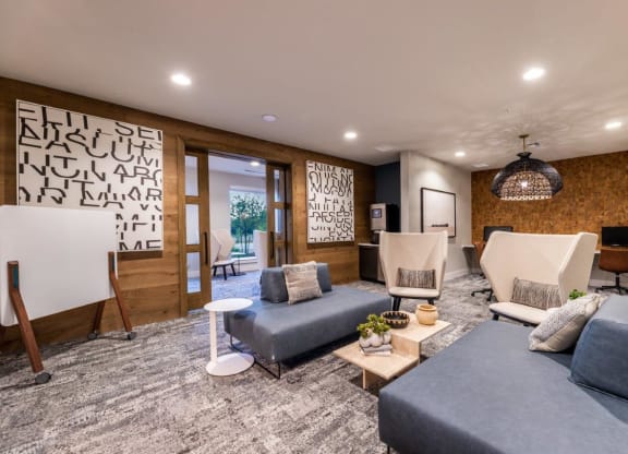 a living room with couches and chairs and a television