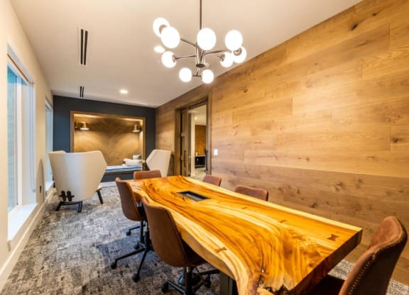 a conference room with a wooden table and chairs