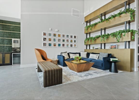 a living room with a blue couch and a coffee table