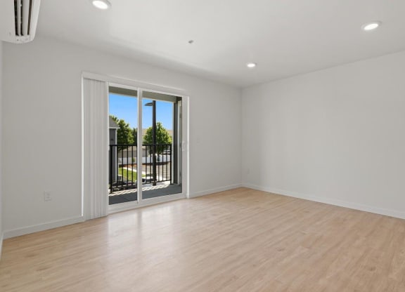 Mill Creek Apartments Living Room with Private Balcony