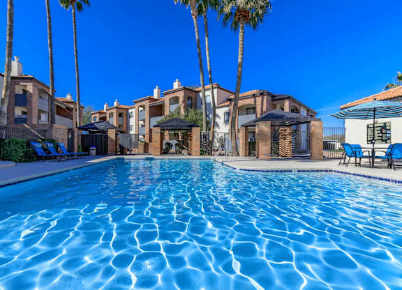 Mission Antigua Apartments in Tucson, Arizona Exterior and Pool with Lounge Chairs